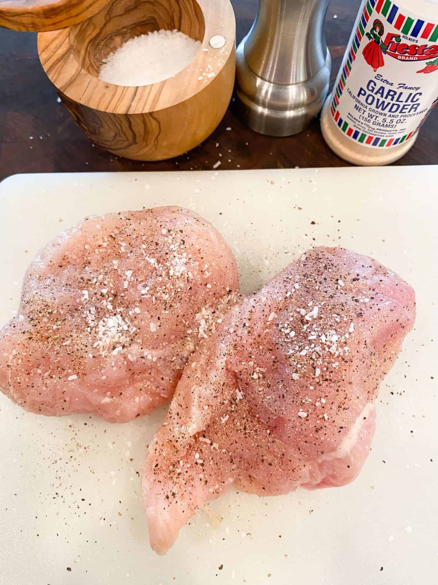 season-both-sides-of-chicken-breast-with-salt-pepper-and-garlic-powder