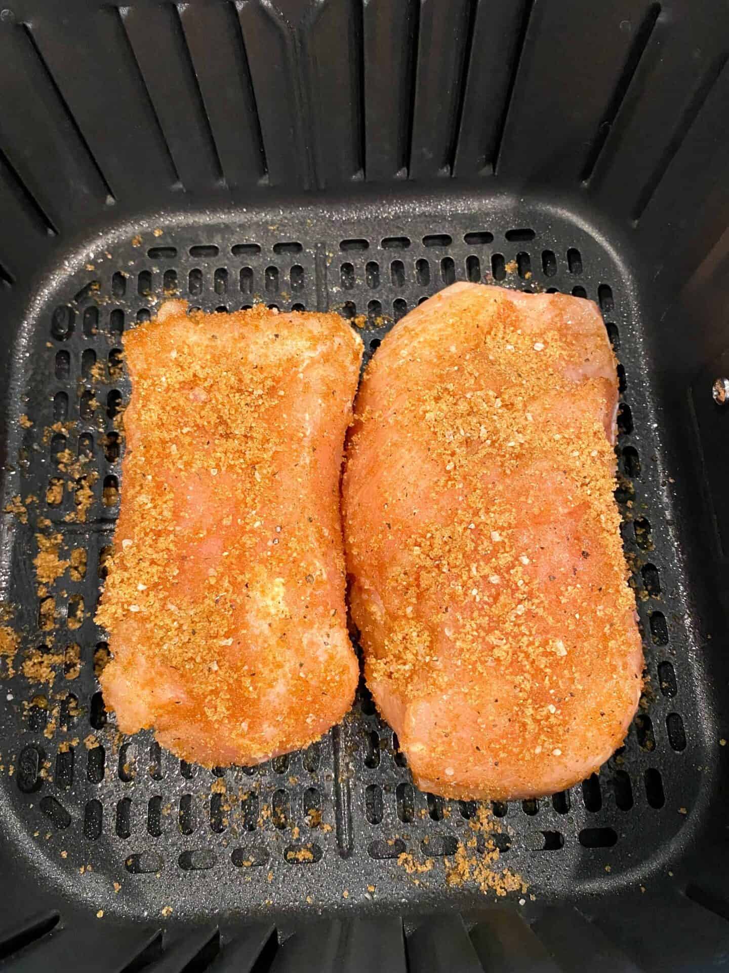 spread-seasoning-on-both-side-of-chicken-breast-and-place-in-air-fryer-sprayed-with-cooking-spray