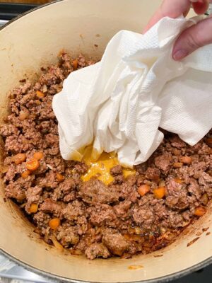 use-paper-towel-to-dab-out-extra-fat-from-ground-lamb