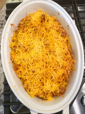 top-with-more-shredded-cheddar