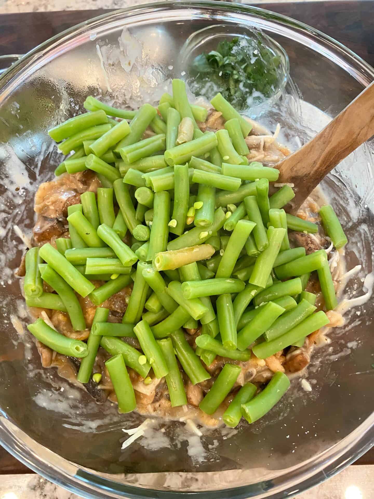 mix cooked green beans into mushroom mixture