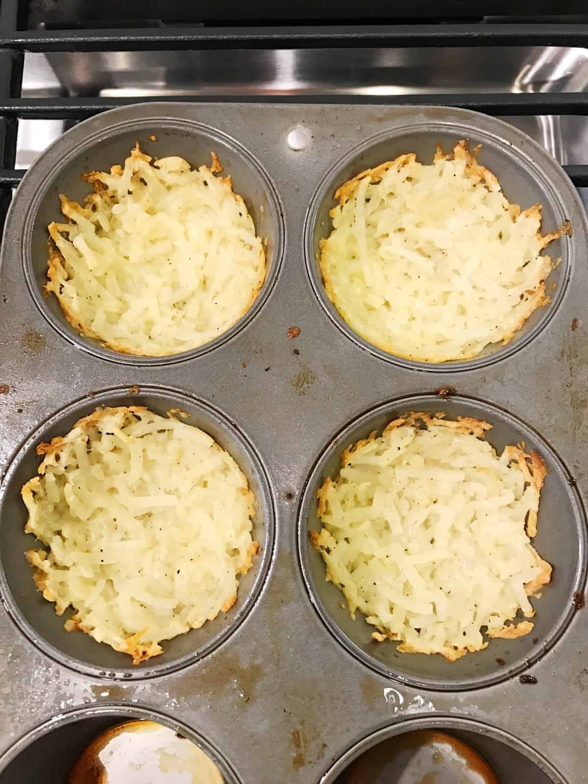 brown hash browns and butter in muffin pan