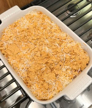top with crushed chips and cheese
